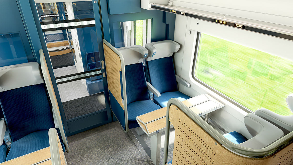 Photo qui représente l'intérieur d'un wagon de train avec une des réalisations de bois courbé.
